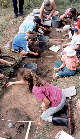 Photo of children participating in an archaeological excavation